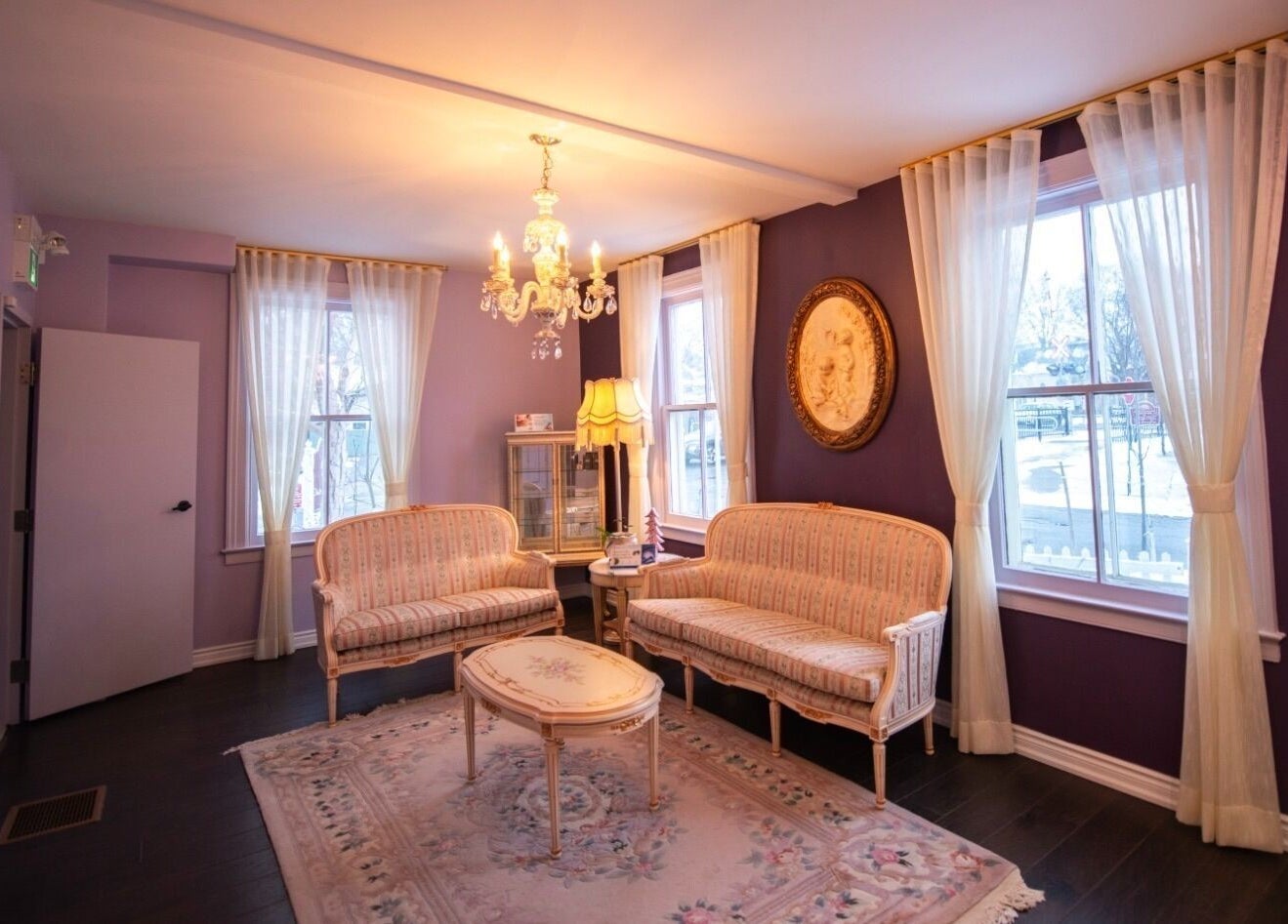 Charming vintage lounge at Times Aesthetic, Markham, Ontario, CA with plush seating and elegant decor.