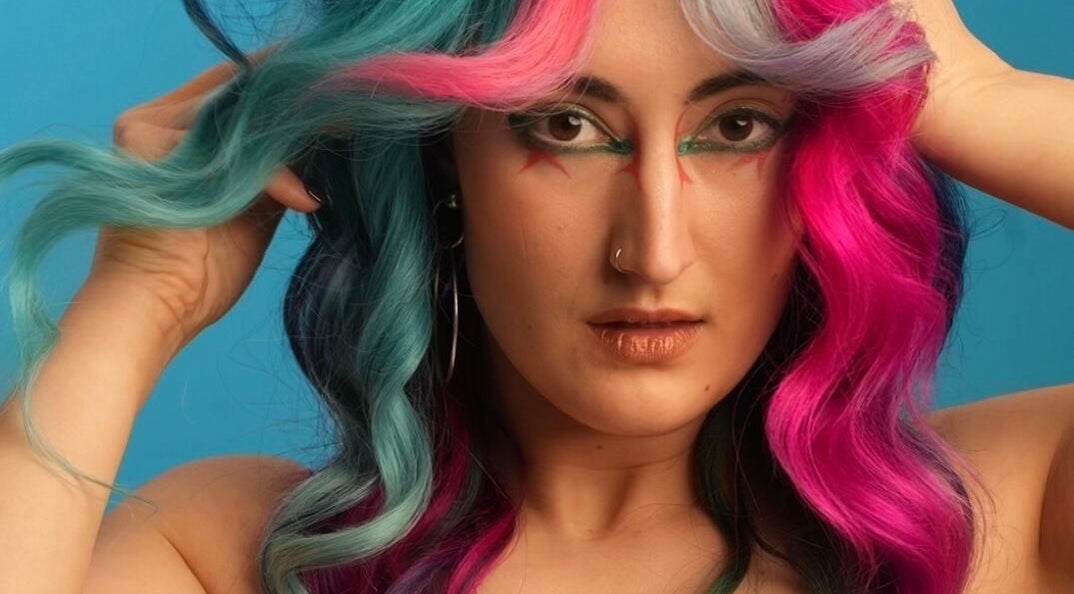 Model with colorful hair at Pinkflamingohairr in Newcastle, Tyne and Wear, GB, showcasing unique style.