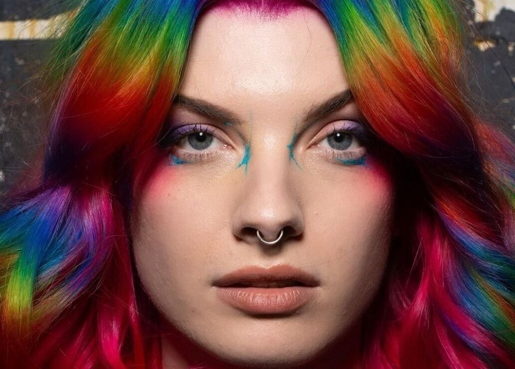 Stunning rainbow hair at Pinkflamingohairr in Newcastle, Tyne and Wear, GB. Vibrant and bold hues for a unique look.