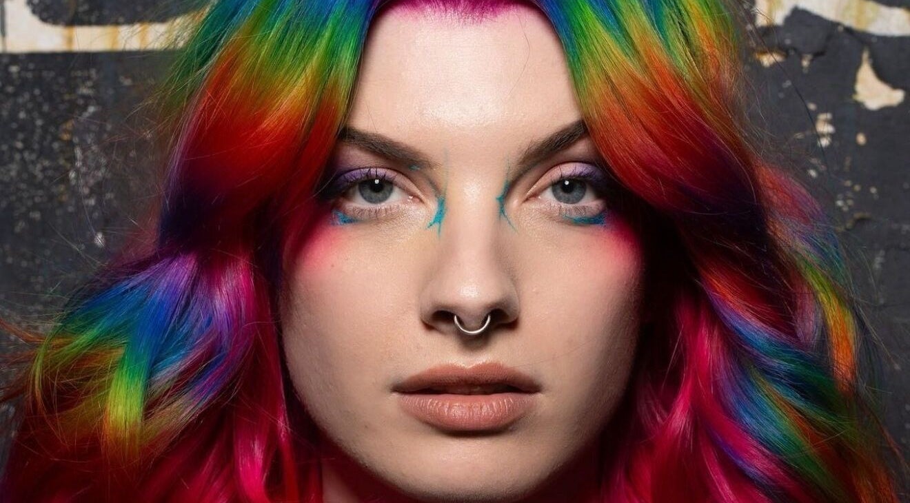 Stunning rainbow hair at Pinkflamingohairr in Newcastle, Tyne and Wear, GB. Vibrant and bold hues for a unique look.