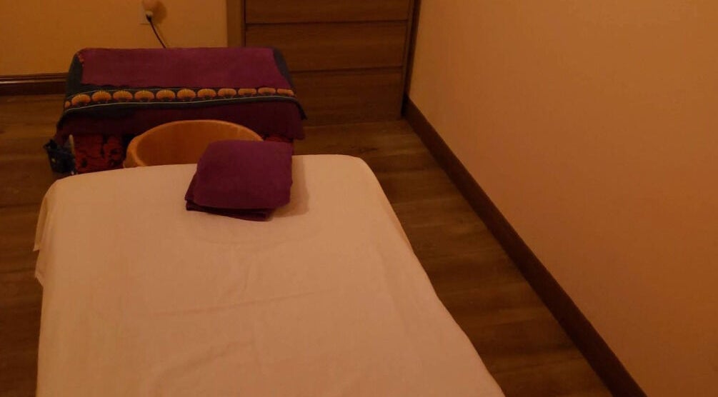 Cozy massage room at Durango Massage, Las Vegas, Nevada, US with soft lighting and inviting decor.