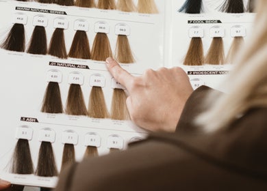 Person choosing hair color from swatches at Willow Hair Co, Gwandalan, NSW, AU.