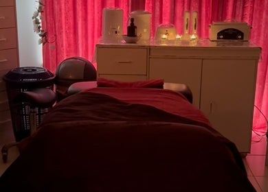 Relaxing massage room at Tranquility in Stratton, Western Australia, AU, featuring cozy ambiance and soft lighting.