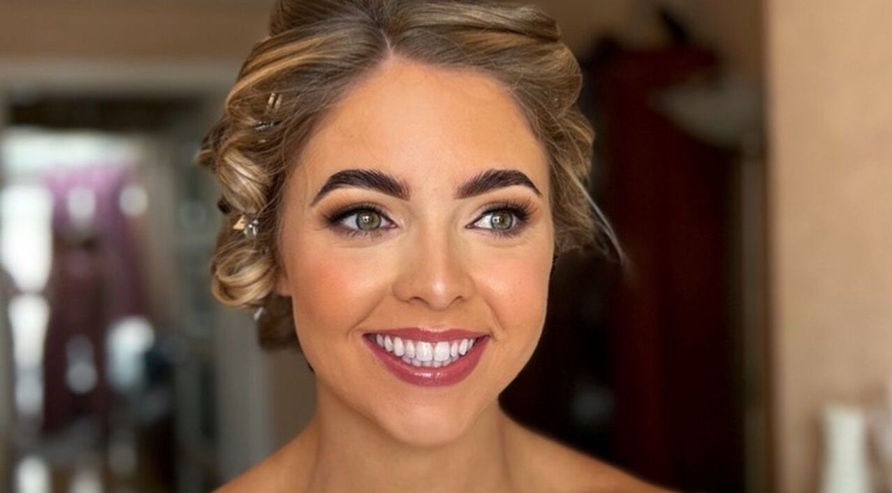 Smiling bride with makeup by Eve Coogan Makeup at Dublin, County Dublin, IE.