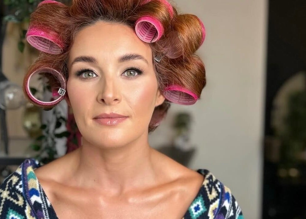 Client with curlers at Eve Coogan Makeup in Dublin, County Dublin, IE, showcasing natural beauty and readiness.