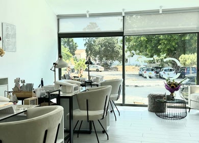 Cozy interior of Cloud7 Nails & Beauty in Paphos, CY, showcasing chic nail service stations.