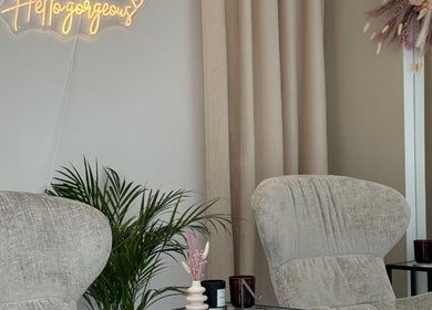 Chic lounge at Cloud7 Nails & Beauty, Paphos, with cozy chairs and decor.