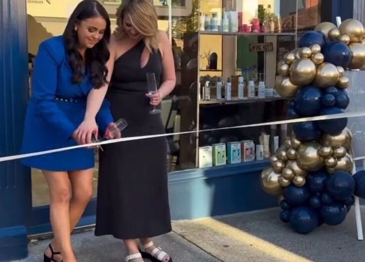 Ribbon-cutting at Colour Palette, County Meath, IE, with two women celebrating with champagne.