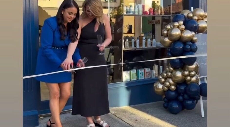 Ribbon-cutting at Colour Palette, County Meath, IE, with two women celebrating with champagne.