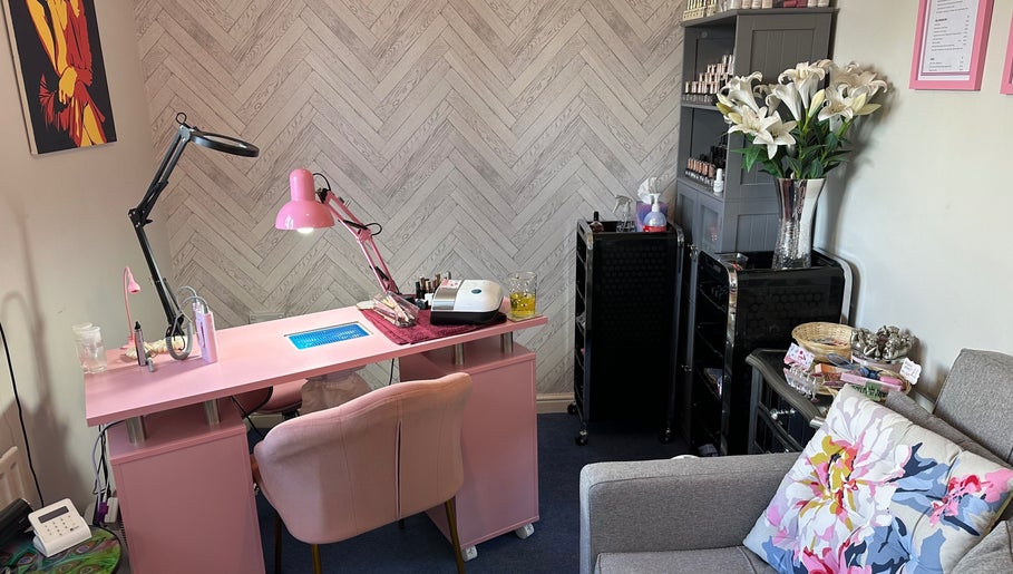 Cozy nail salon setup at Jazz Hands, Ripon, England, GB with pink decor and elegant floral accents.