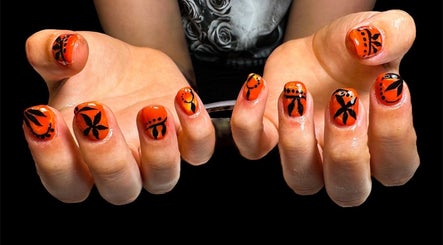 Bold orange and black nail art at Jazz Hands in Ripon, England, GB.