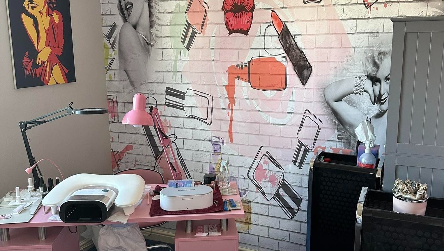 Stylish nail salon at Jazz Hands, Ripon, England, GB with vintage decor and vibrant wall art.