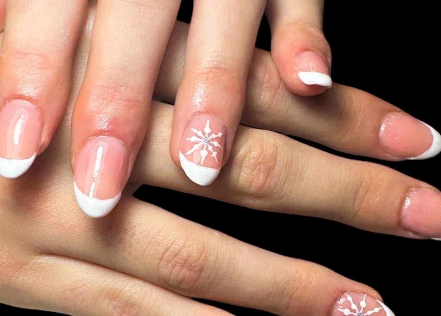 French manicure with snowflake design at Jazz Hands in Ripon, England, GB.