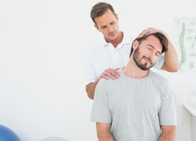 Chiropractor performing neck therapy at Proton Medical Health Center, Jerusalem, Jerusalem District, IL.