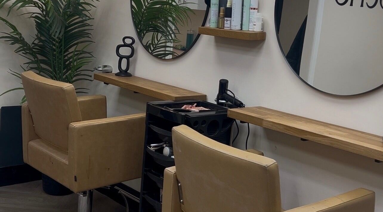 Chic salon chairs and mirrors at OCHO Hair & Beauty, Pontefract, England, GB. Relaxing and stylish interior.
