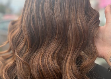 Close-up of wavy brunette hairstyle at Hair By Aimee, Birmingham, England, GB.