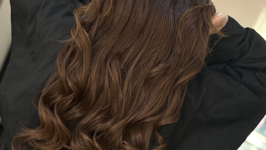 Beautifully styled brown curls at Hair By Aimee in Birmingham, England, GB. Expert haircare for stunning results.