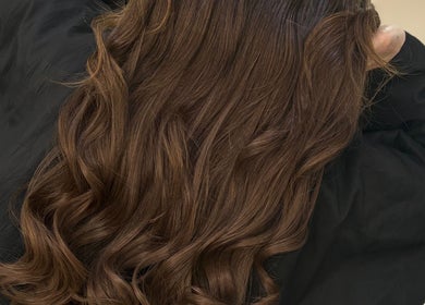 Beautifully styled brown curls at Hair By Aimee in Birmingham, England, GB. Expert haircare for stunning results.