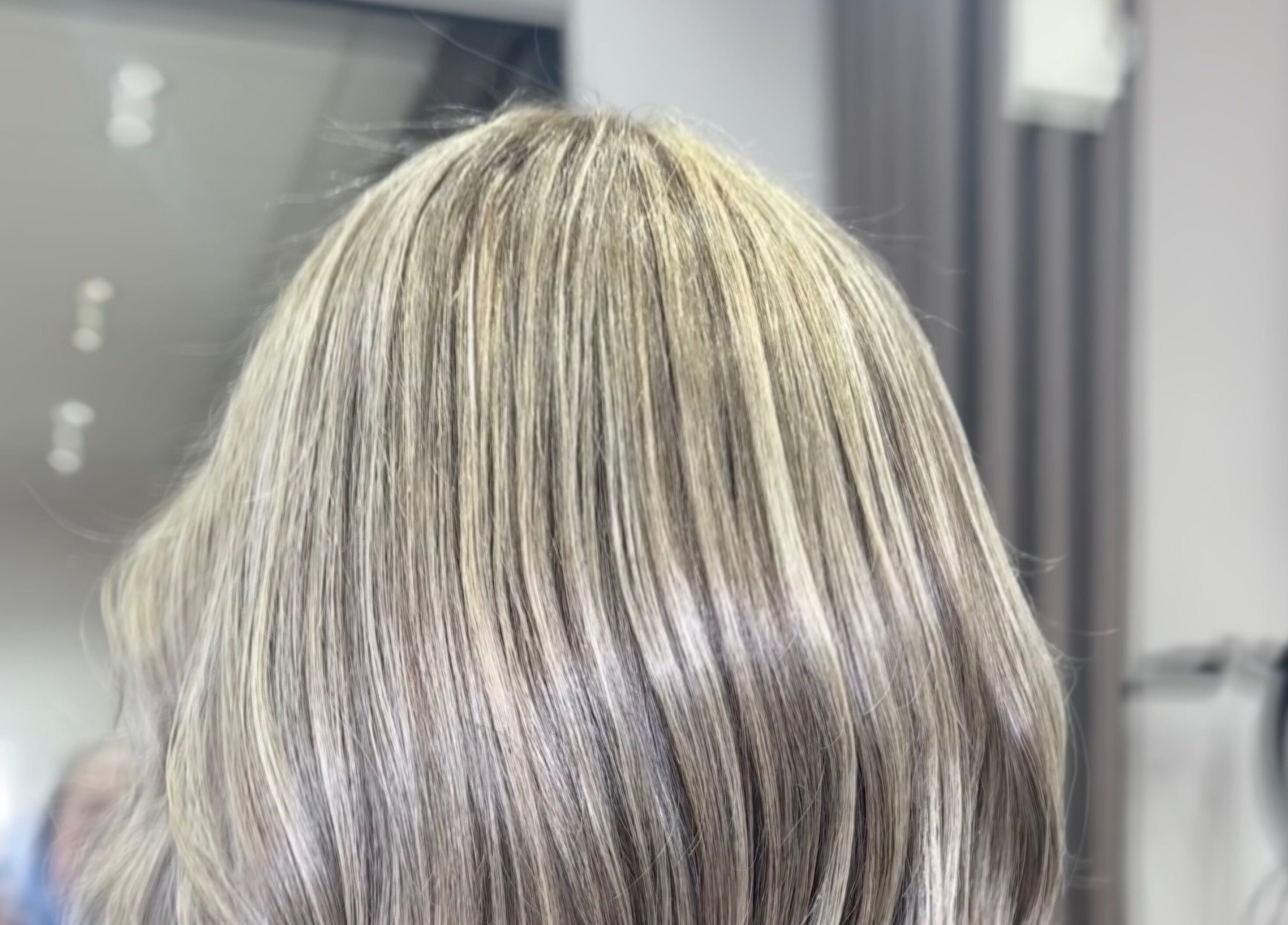 Close-up of stylish blonde highlights by Hair By Aimee, Birmingham, England, GB.