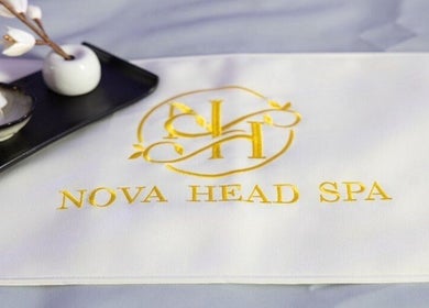 Elegant logo of Nova Head Spa: Stone Oak, San Antonio, Texas, US with a floral arrangement.