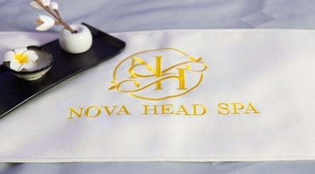 Elegant logo of Nova Head Spa: Stone Oak, San Antonio, Texas, US with a floral arrangement.
