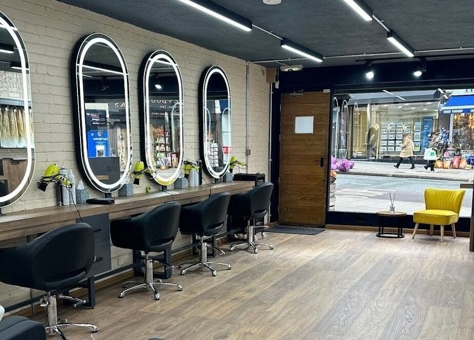 Elegant mirrors and styling chairs at Omis Hair West Hampstead, London, England, GB.