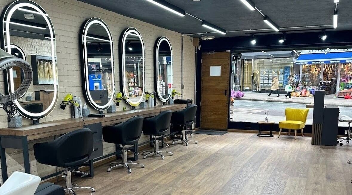 Elegant mirrors and styling chairs at Omis Hair West Hampstead, London, England, GB.