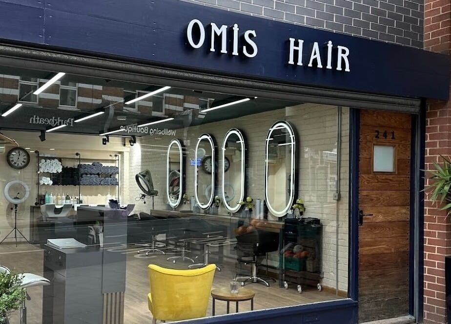 Front view of Omis Hair West Hampstead, a stylish salon in London, England, GB with elegant interiors and warm ambiance.