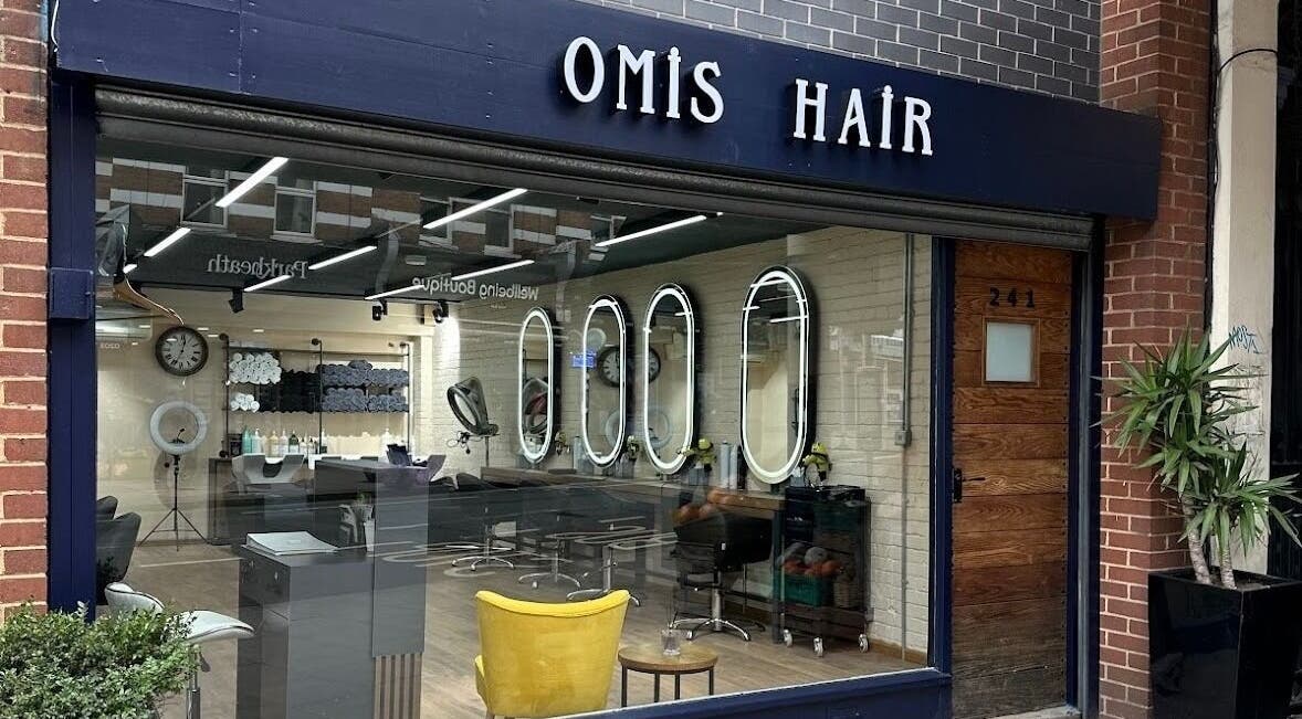 Front view of Omis Hair West Hampstead, a stylish salon in London, England, GB with elegant interiors and warm ambiance.