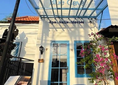 Front view of Blue Cave Spa in Bali, Bali, ID, showcasing a bright entrance with floral accents.