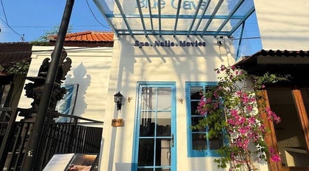 Front view of Blue Cave Spa in Bali, Bali, ID, showcasing a bright entrance with floral accents.