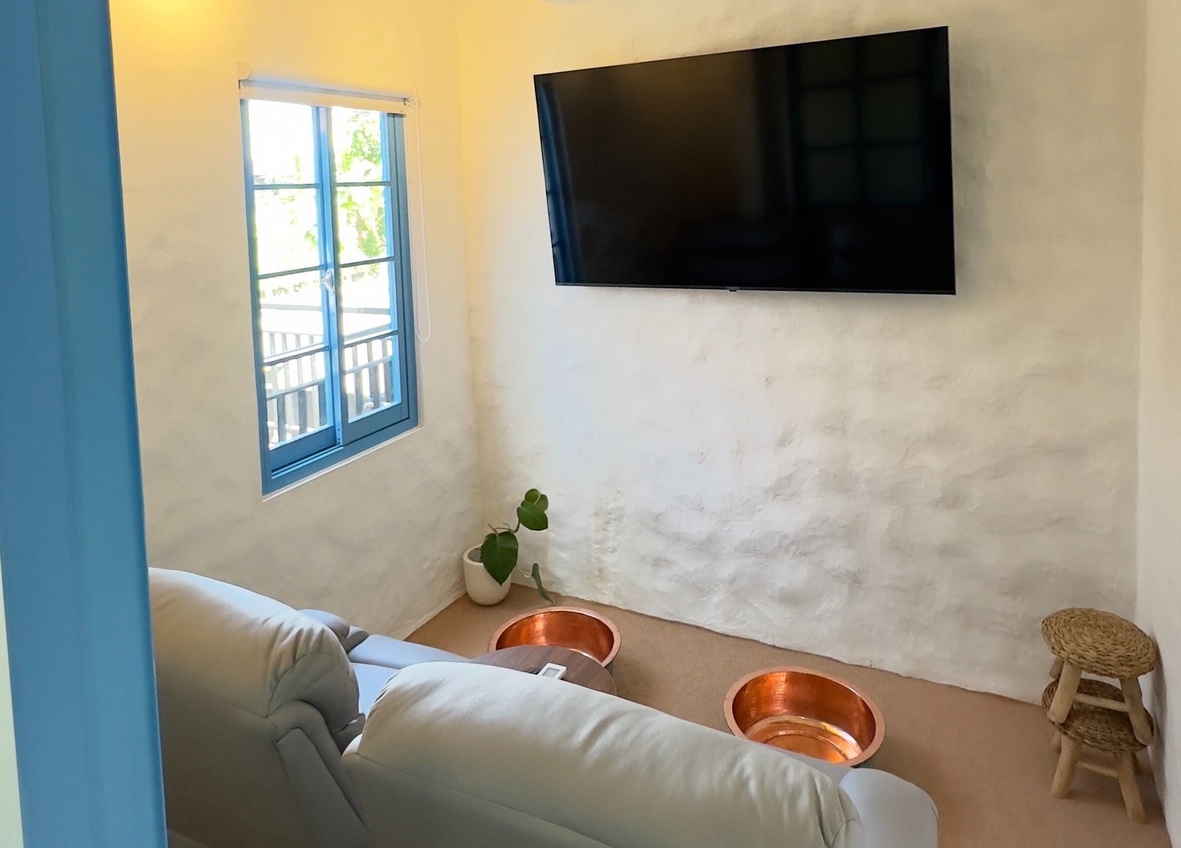 Relaxing foot spa area with copper bowls at Blue Cave Spa, Bali, Bali, ID, offering calming treatments.