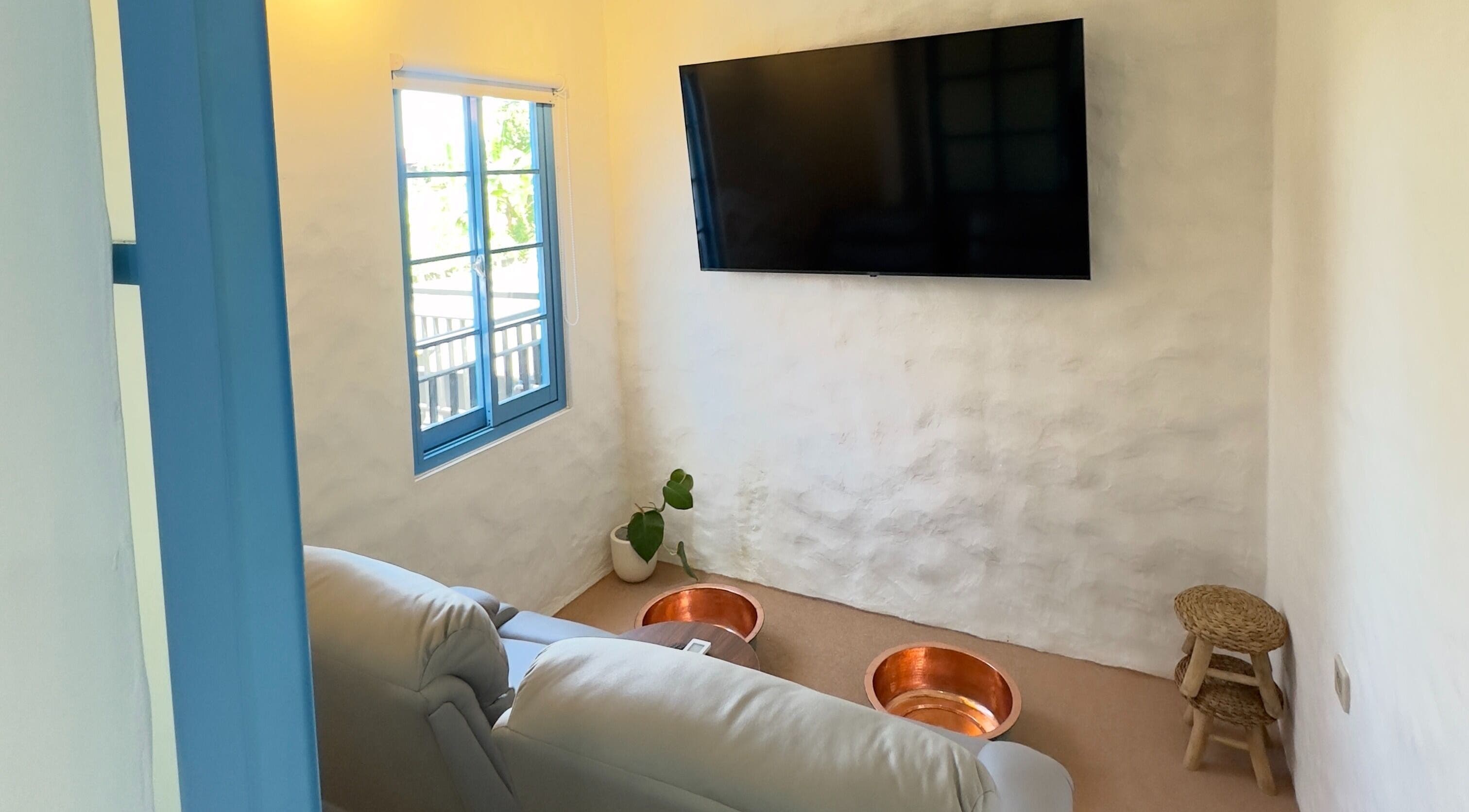 Relaxing foot spa area with copper bowls at Blue Cave Spa, Bali, Bali, ID, offering calming treatments.