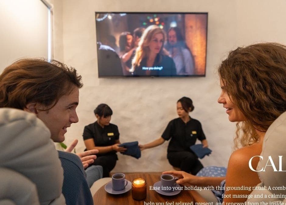 Couple enjoys foot massage at Blue Cave Spa in Bali, Bali, ID, with calming ambiance and attentive staff.