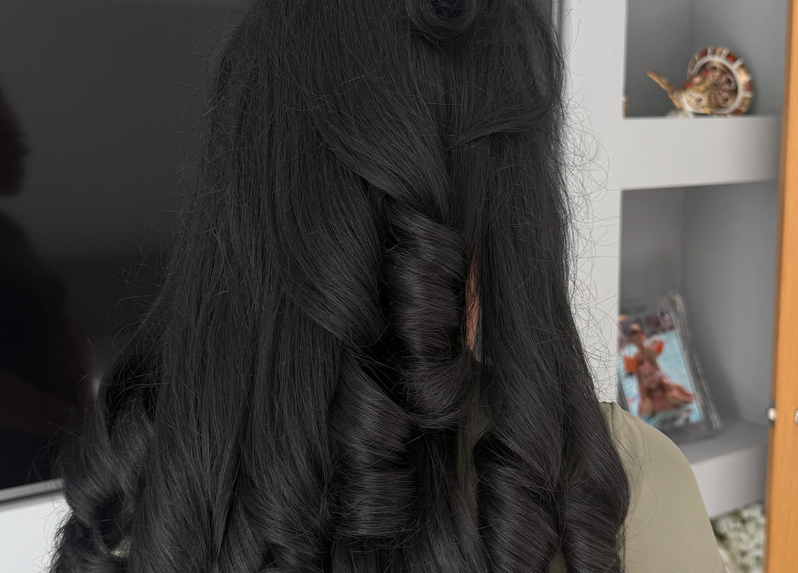 Beautifully styled curly hair at Dolled Up, Bournemouth, England, GB. Perfect for a special occasion.