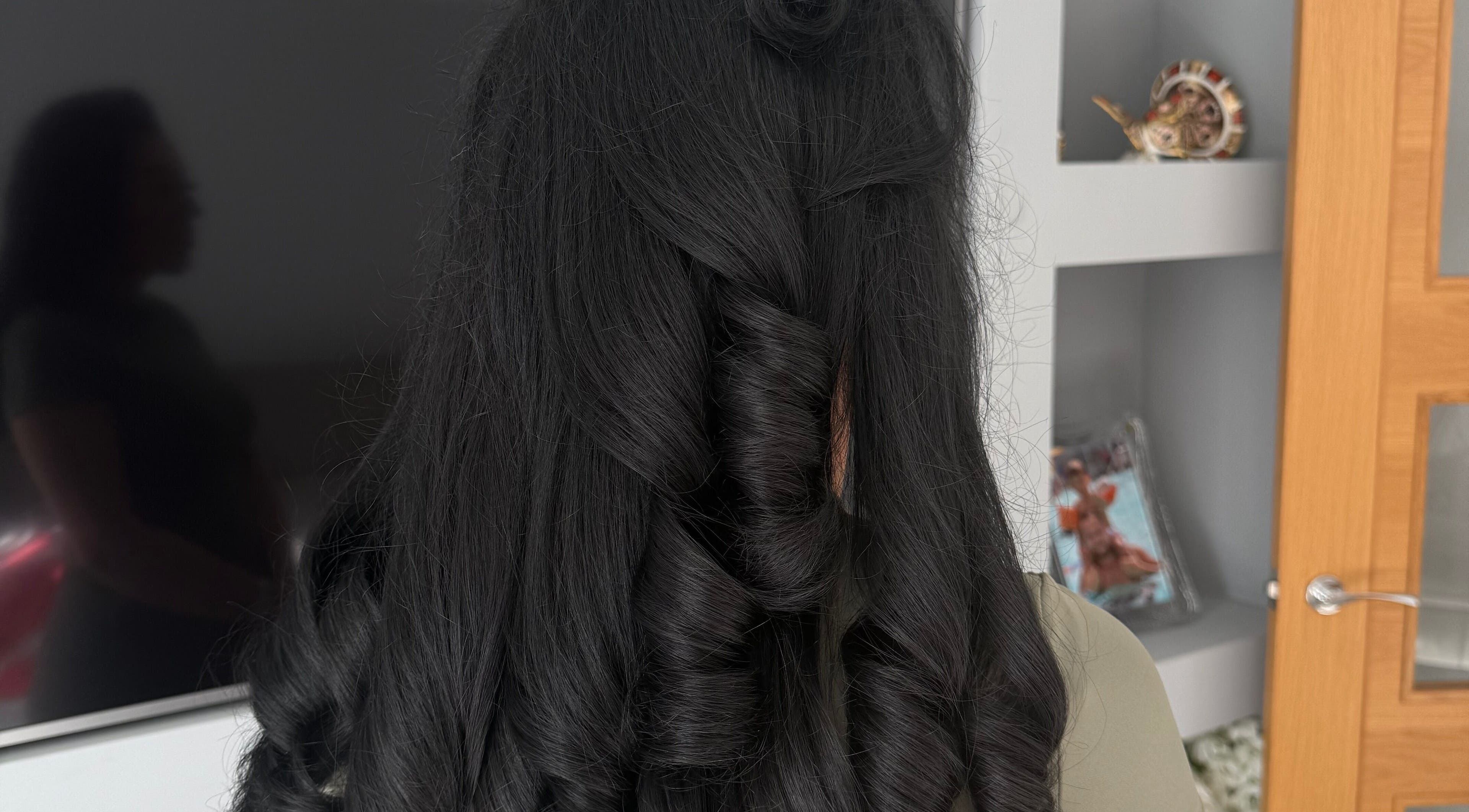 Beautifully styled curly hair at Dolled Up, Bournemouth, England, GB. Perfect for a special occasion.