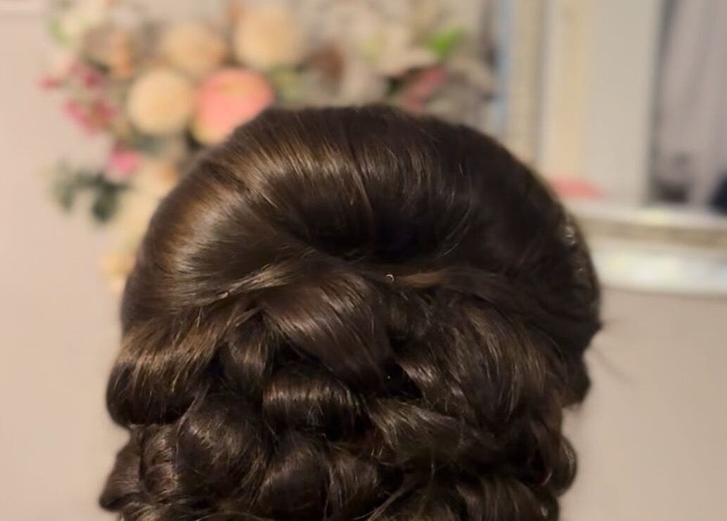 Stylish updo hairstyle at Dolled Up, Bournemouth, England, GB, showcasing professional beauty services.
