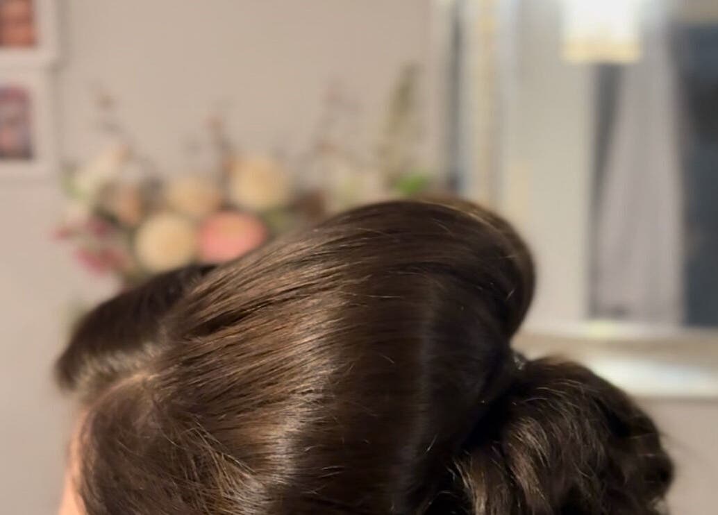 Stylish hair updo at Dolled Up, Bournemouth, England, GB. Reflects elegant salon atmosphere and artistry.