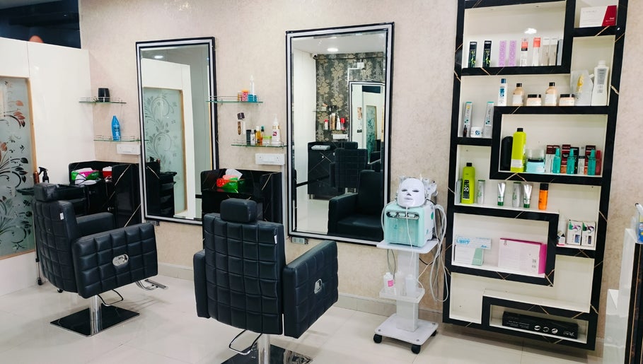 Modern salon interior at Style N Shine, Secunderabad, Telangana, IN featuring styling chairs and product shelves.
