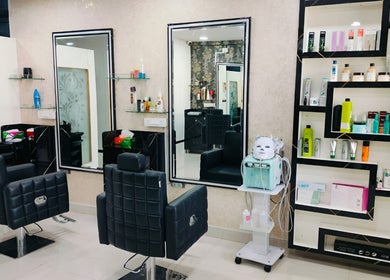 Modern salon interior at Style N Shine, Secunderabad, Telangana, IN featuring styling chairs and product shelves.