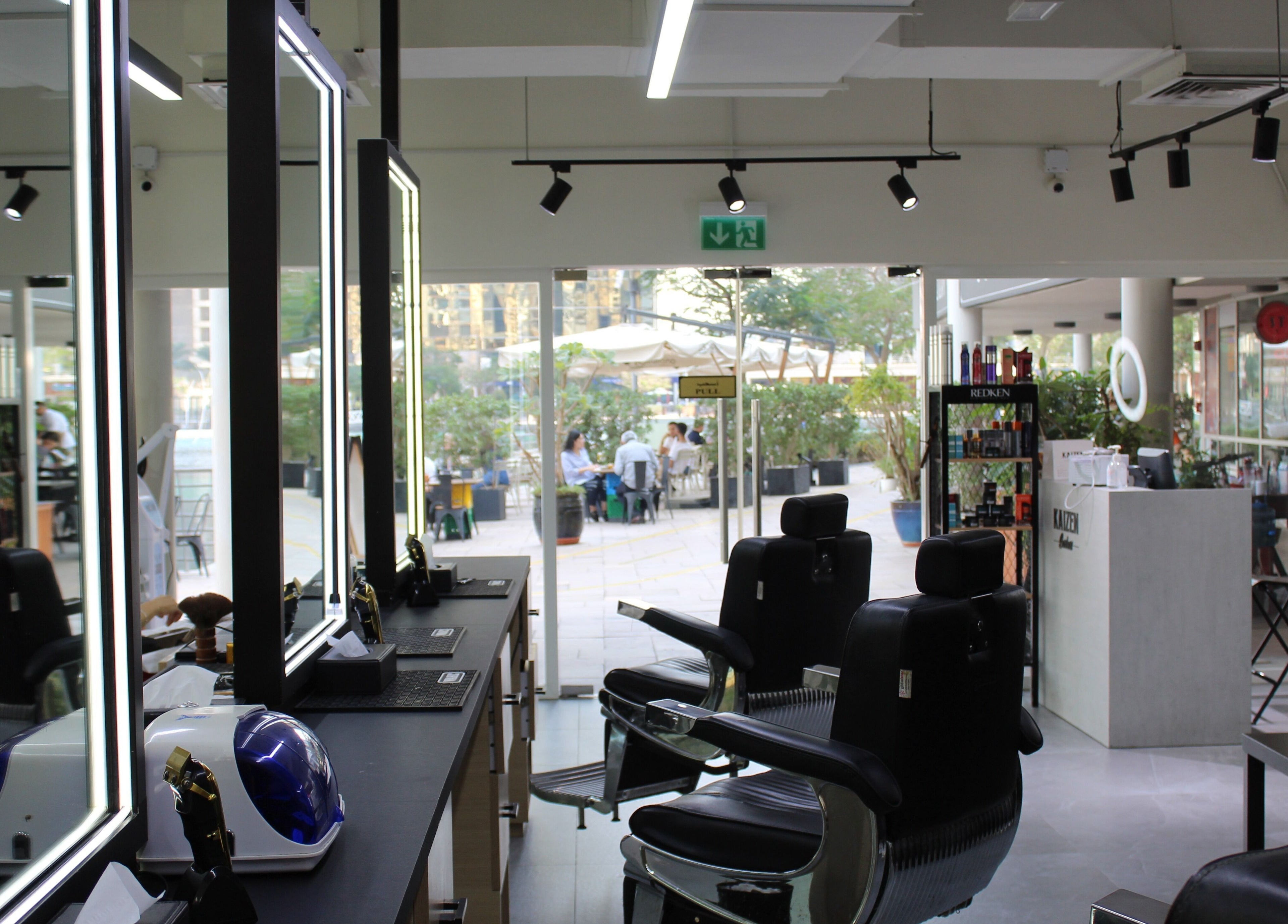 Interior of Kaizen Barbershop with sleek barber chairs in Dubai, Dubai, AE.
