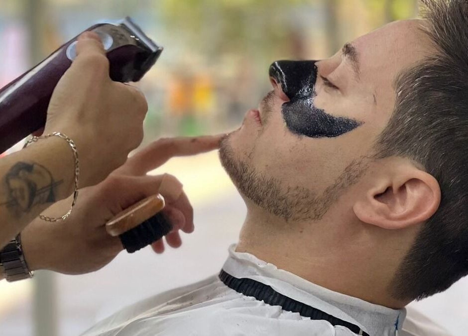 Client receives a precise shave at Kaizen Barbershop, Dubai. Experience grooming excellence in Dubai, AE.