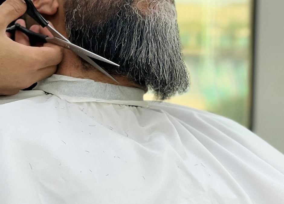 Beard grooming session at Kaizen Barbershop, Dubai, Dubai, AE with expert scissors trimming.