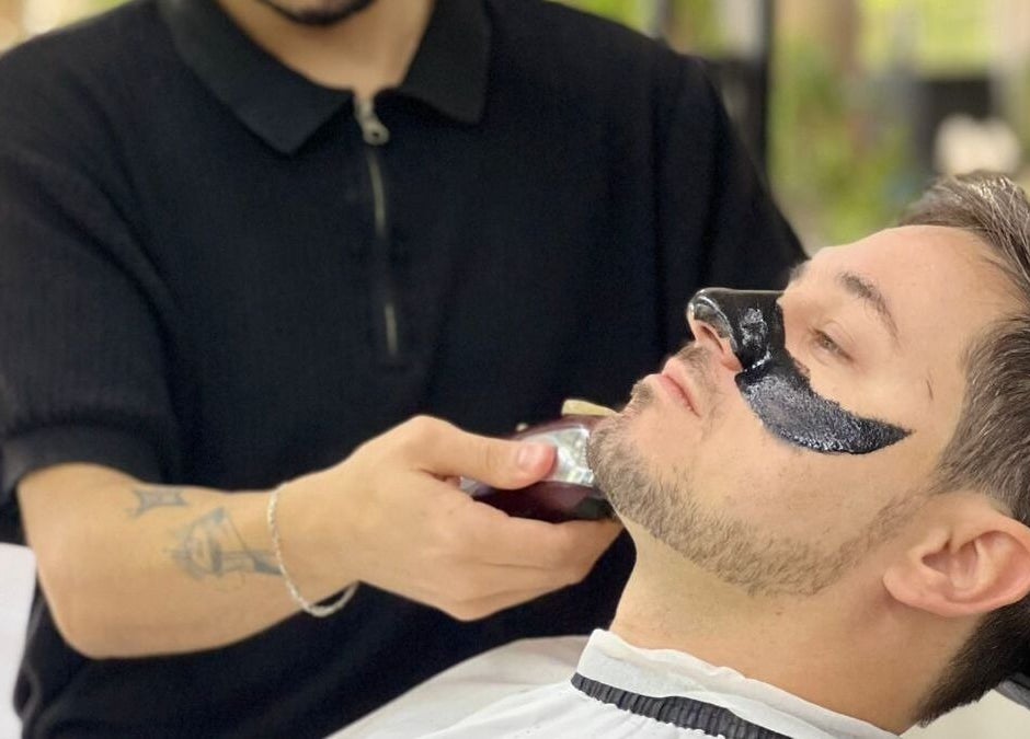 A client receives grooming and skin treatment at Kaizen Barbershop, Dubai, Dubai, AE.