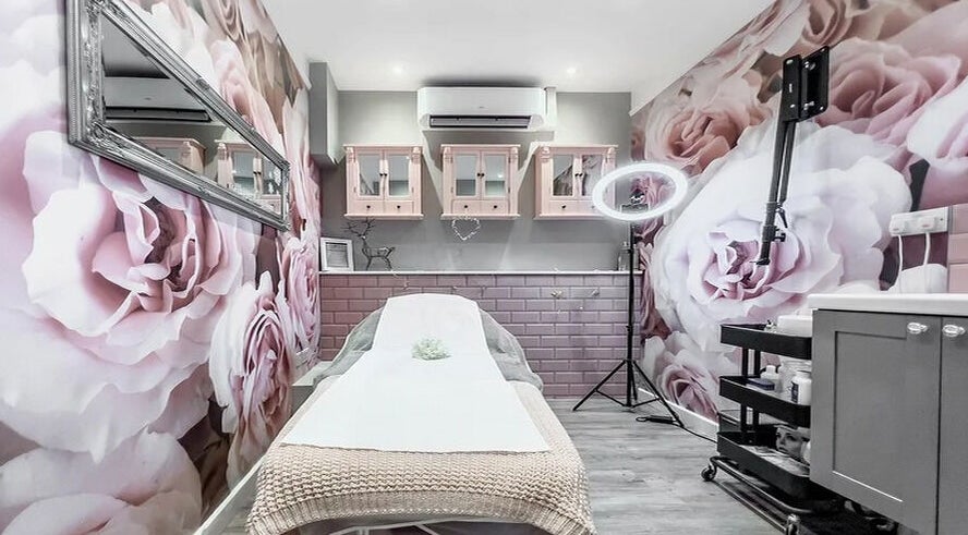 Tranquil treatment room with floral decor at Perfect You in Teddington, England, GB.
