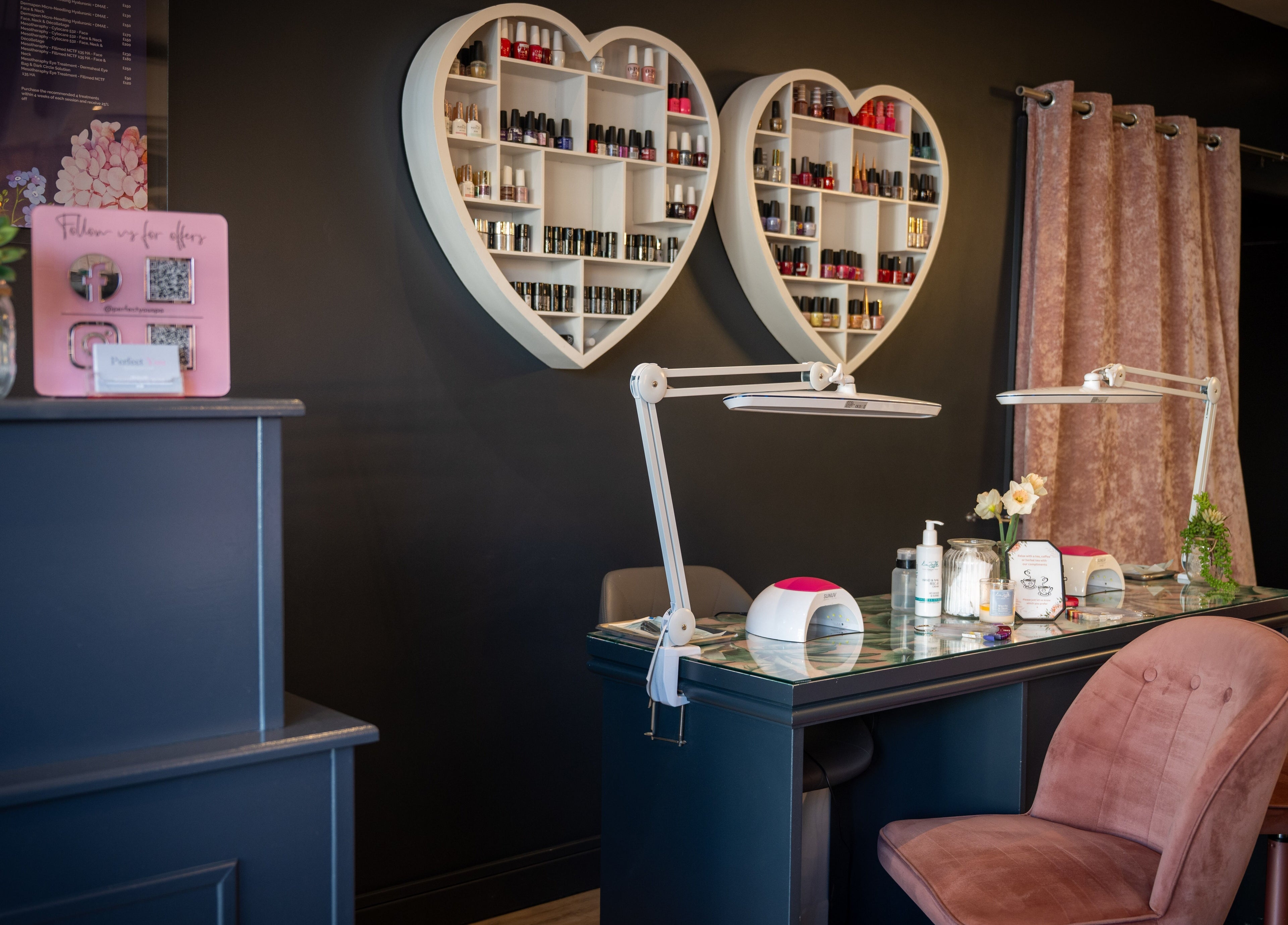 Sophisticated nail studio at Perfect You, Teddington, England. Heart shelves display nail polishes.