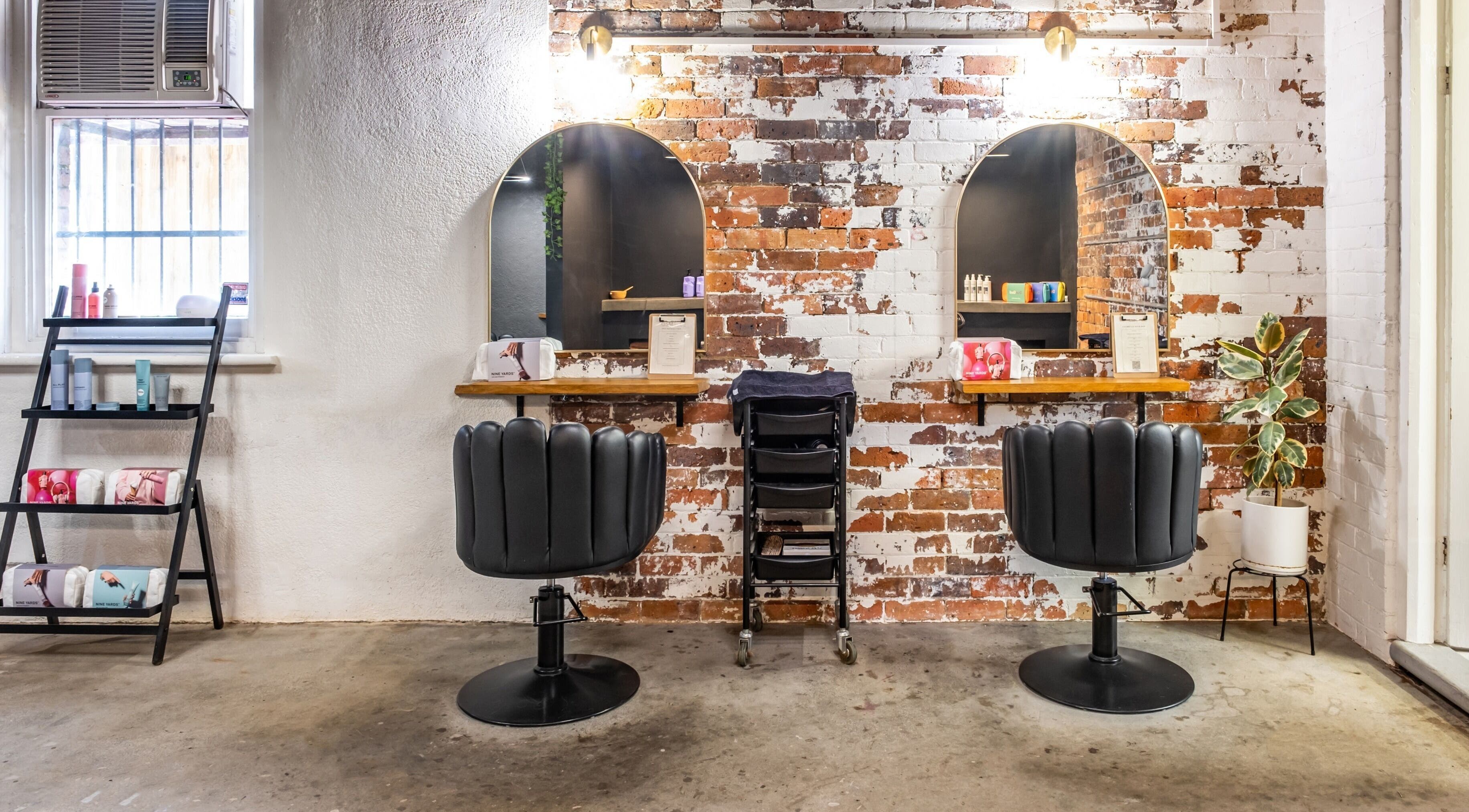 Modern salon chairs and vintage mirrors at Cosmelle Beauty + Hair in Launceston, Tasmania, AU.