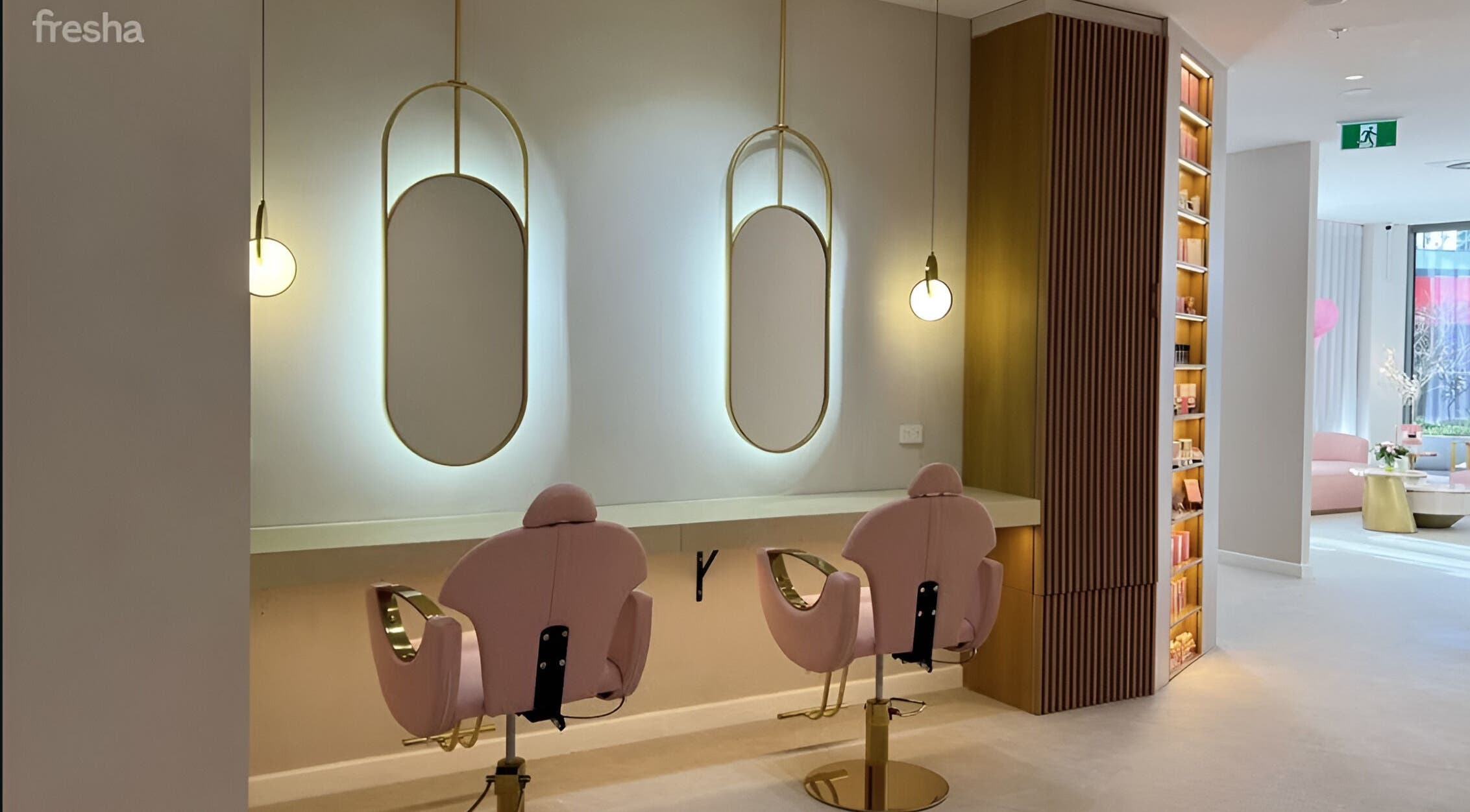 Chic styling area at Posh Deluxe, Mount Pleasant, Western Australia, AU with pink chairs and modern mirrors.