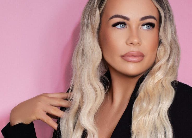 Glamorous individual at Posh Deluxe, Mount Pleasant, Western Australia, AU, with styled hair and makeup.