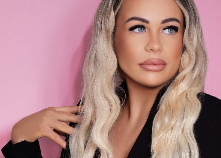 Glamorous individual at Posh Deluxe, Mount Pleasant, Western Australia, AU, with styled hair and makeup.